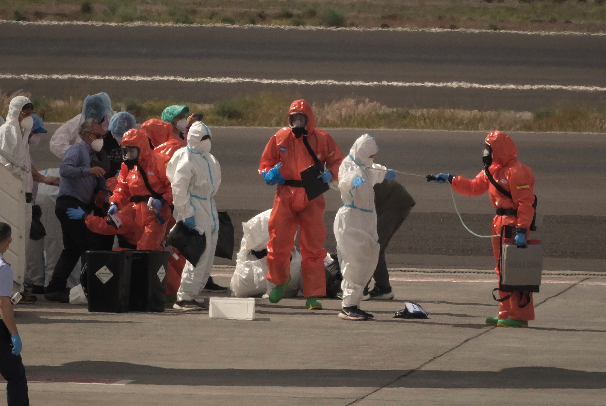 APTOPIX Spain Hantavirus Ship Image: People Related to Hantavirus Being Sprayed